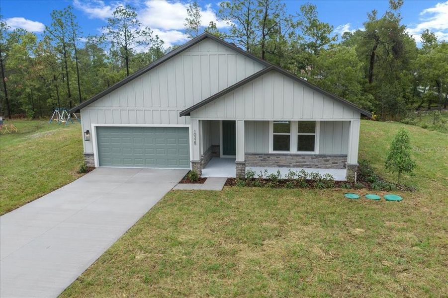 Front exterior of a new home in , Weeki Wachee, FL, highlighting curb appeal (Image 2). Front exterior of a new home in , Weeki Wachee, FL, highlighting curb appeal (Image 2).