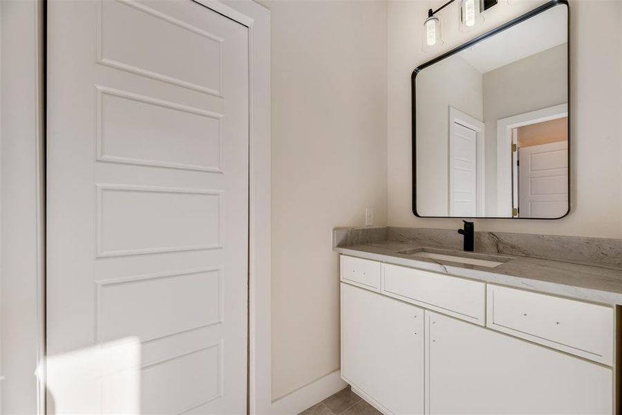 Half bath featuring vanity Half bath featuring vanity