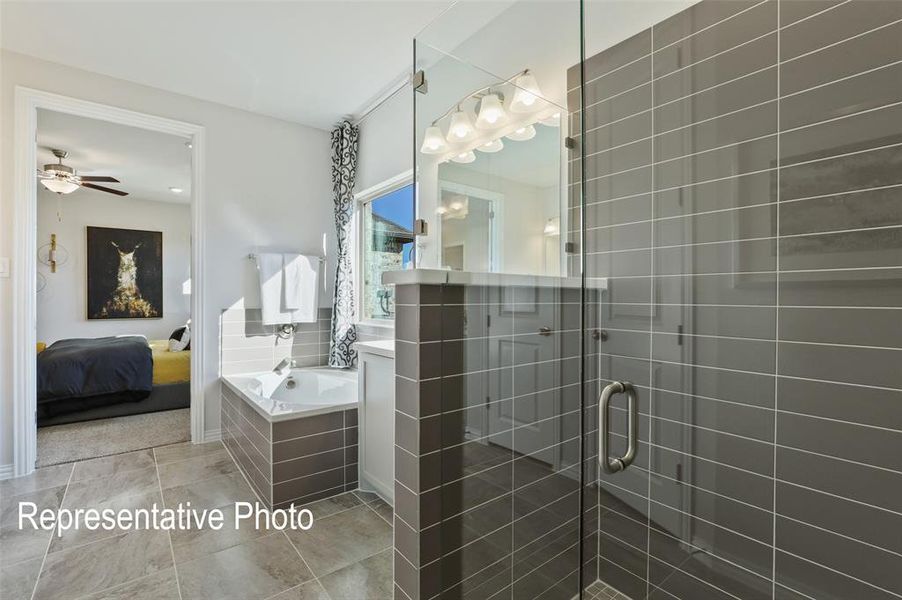 Bathroom with vanity, tile flooring, shower with separate bathtub, and ceiling fan