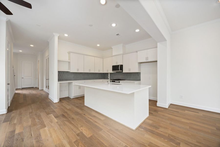 This light-filled layout delivers everything you're looking for —open-concept living, elegant engineered wood floors, tall ceilings, and backyard views, all on the first floor.