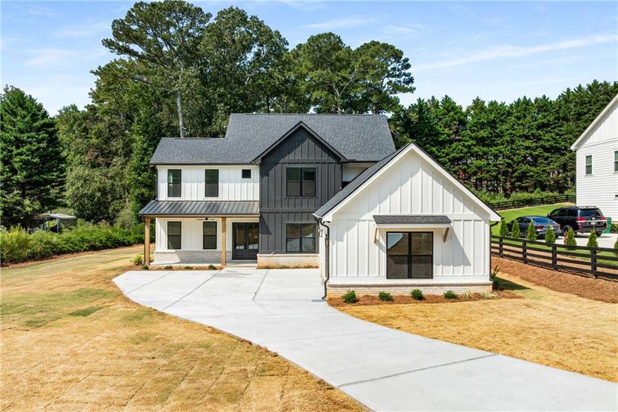 Front exterior of a new home in , Alpharetta, GA, highlighting curb appeal (Image 24). Front exterior of a new home in , Alpharetta, GA, highlighting curb appeal (Image 24).