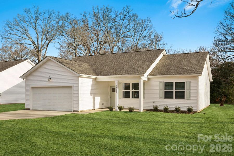 Front exterior of a new home in , Monroe, NC, highlighting curb appeal (Image 23).