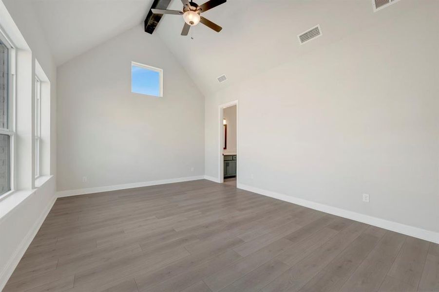 Unfurnished room with ceiling fan and light wood-style flooring