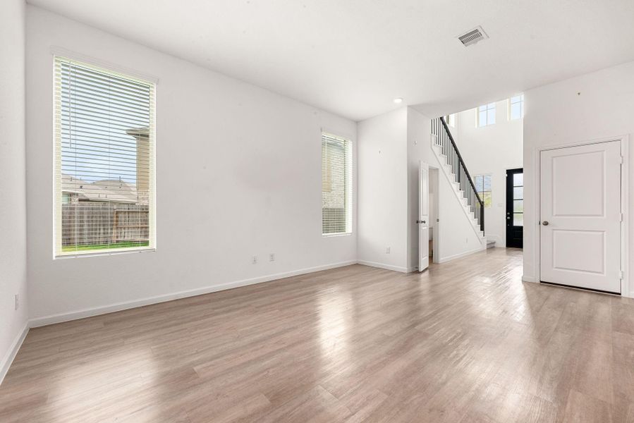 Spacious, unfurnished interior of a new home in Sunterra, Katy (Image 33).