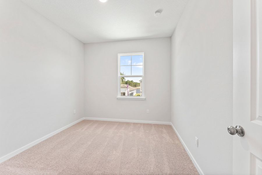 Lot 20 Ponderosa II Guest Bedroom with Front Window at Camden Woods in Kingsland, GA