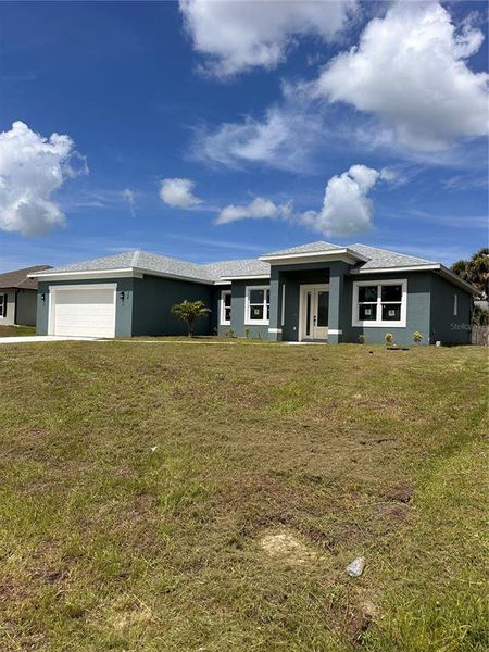 Front exterior of a new home in , Palm Bay, FL, highlighting curb appeal (Image 37). Front exterior of a new home in , Palm Bay, FL, highlighting curb appeal (Image 37).