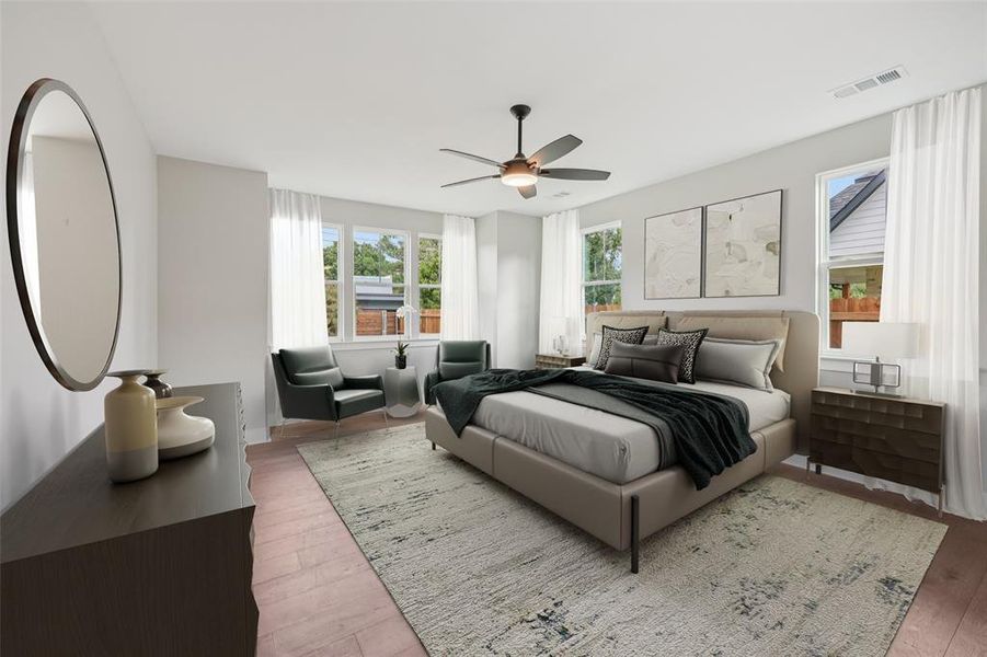 Bedroom with wood finished floors and a ceiling fan