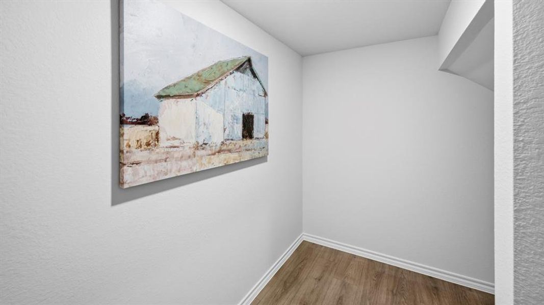 Corridor with wood finished floors and baseboards Corridor with wood finished floors and baseboards