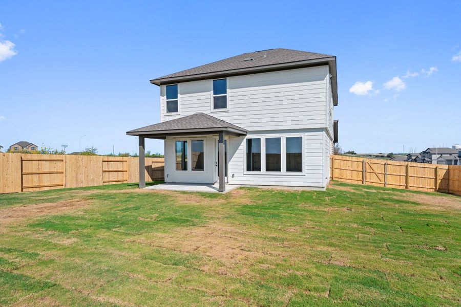 Exterior details and patio area of a home in Terrace Collection At Turner's Crossing, Buda (Image 26).