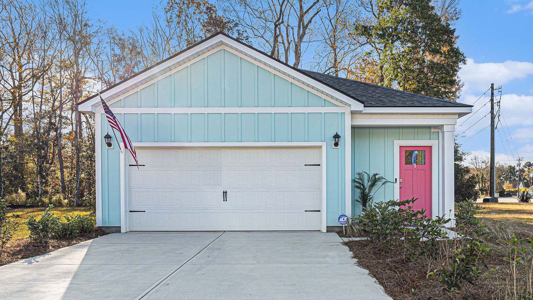 Front exterior of a new home in Southshore Bay, Sunset Beach, NC, highlighting curb appeal (Image 2). Front exterior of a new home in Southshore Bay, Sunset Beach, NC, highlighting curb appeal (Image 2).