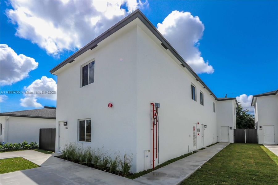 Front exterior of a new home in , Miami, FL, highlighting curb appeal (Image 1).