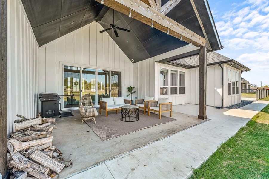 View of patio / terrace with a ceiling fan, area for grilling, and an outdoor living space