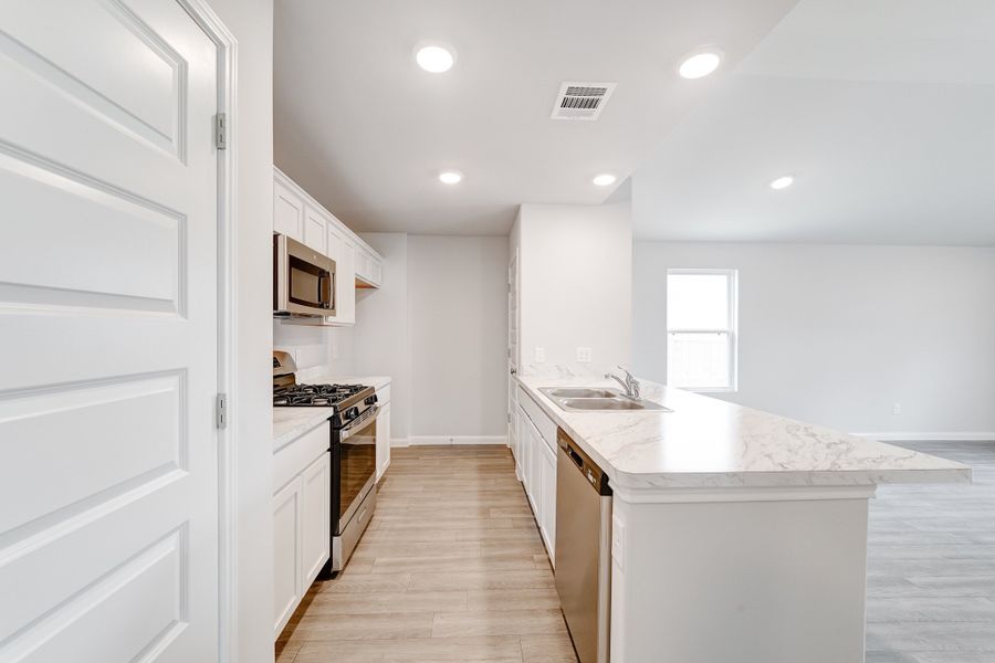 Furnished interior view inside a new home in Madalynn Estates, Corpus Christi (Image 9).