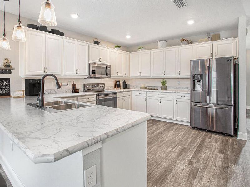 Spacious, open kitchen with pantry, counter-height bar, and your choice of finishes - Wayfair by Highland Homes