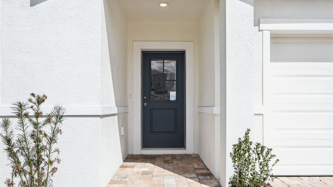 Representative exterior photo of a completed home built from the Baker by DRB Homes in Hamilton Bluff, Haines City, FL (Image 26).