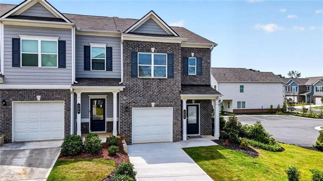 Front exterior of a new home in Fuller Station, Loganville, GA, highlighting curb appeal (Image 29).
