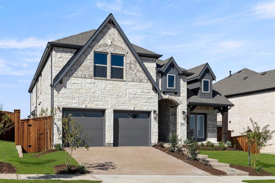 Front exterior of a new home in Inspiration, Lucas, TX, highlighting curb appeal (Image 22). Front exterior of a new home in Inspiration, Lucas, TX, highlighting curb appeal (Image 22).