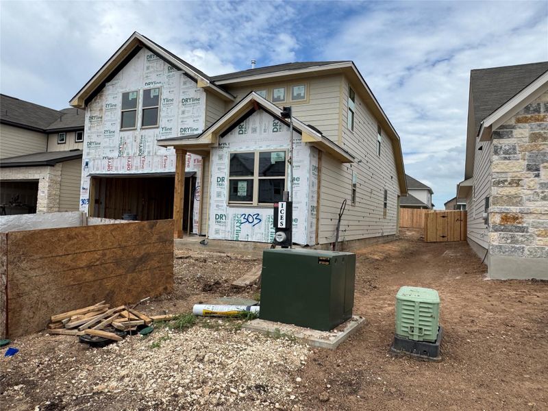 Front exterior of a new home in Rolling Glen, Hutto, TX, highlighting curb appeal (Image 13).
