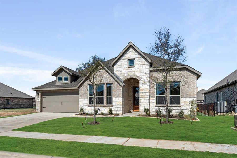 Front exterior of a new home in Abe's Landing, Granbury, TX, highlighting curb appeal (Image 2). Front exterior of a new home in Abe's Landing, Granbury, TX, highlighting curb appeal (Image 2).
