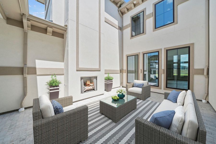 Stunning courtyard with elegant landscaping, grand staircase, and impressive architectural design.