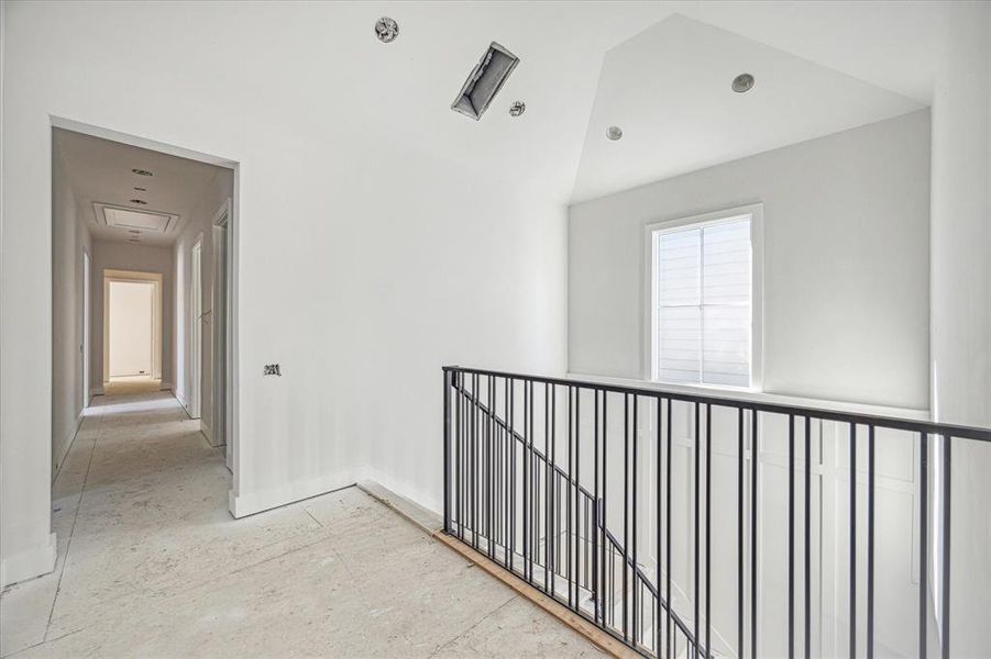 Second floor landing with hallway leading to master suite. Estimated completion date of construction - January 15, 2025.