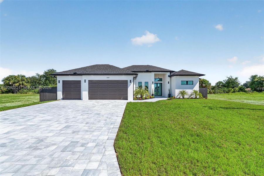 Front exterior of a new home in , Cape Coral, FL, highlighting curb appeal (Image 27).