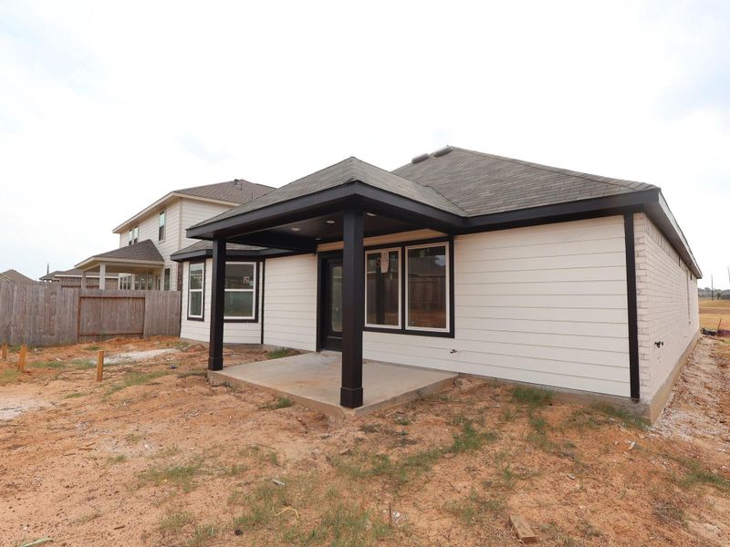 Exterior details and patio area of a home in Magnolia Ridge, Magnolia (Image 4).