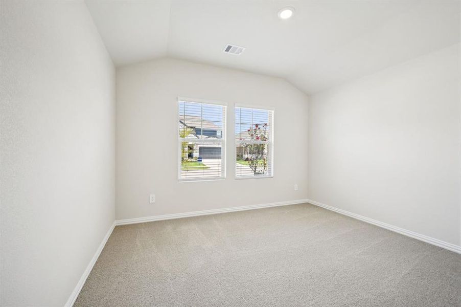 Room with light carpet, lofted ceiling, and recessed lighting