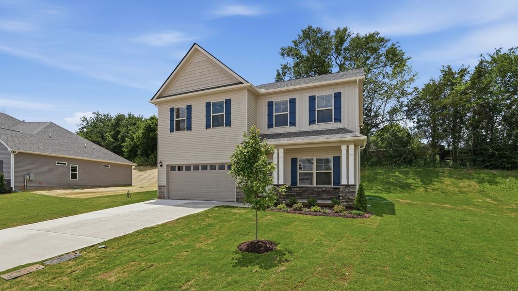 Front exterior of a new home in Wheatfield, Shelbyville, TN, highlighting curb appeal (Image 21). Front exterior of a new home in Wheatfield, Shelbyville, TN, highlighting curb appeal (Image 21).