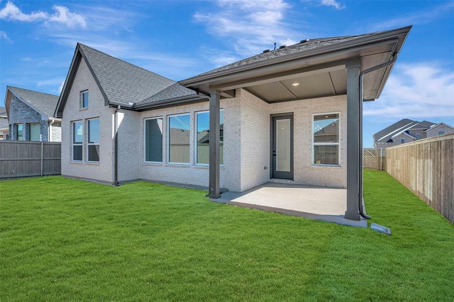 Exterior details and patio area of a home in Pecan Square - Gardens, Northlake (Image 3).
