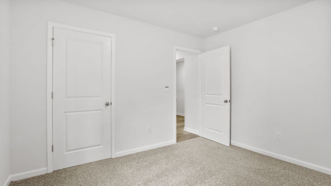 Spacious, unfurnished interior of a new home in Bentley Park, Greenwood (Image 16).