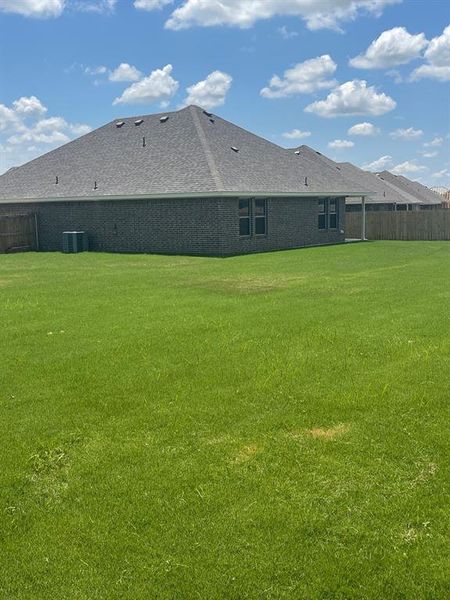 View of yard featuring central AC unit