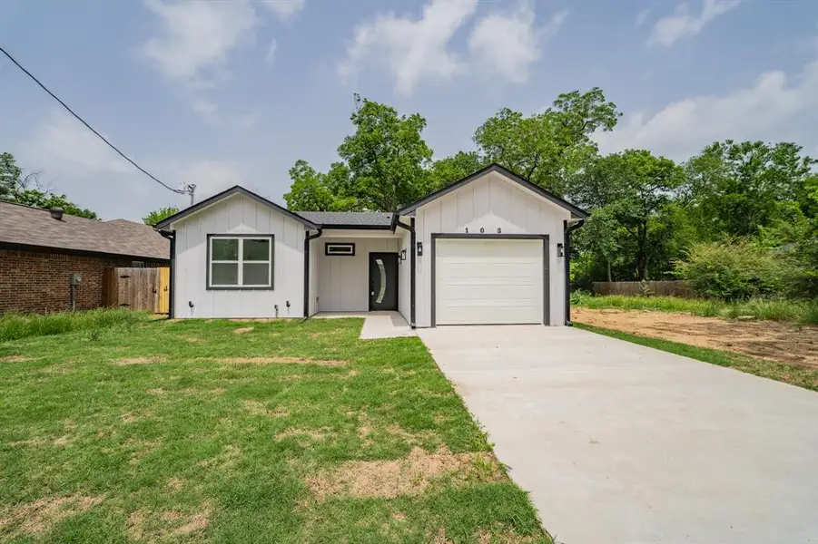 Front exterior of a new home in , Sulphur Springs, TX, highlighting curb appeal (Image 17).