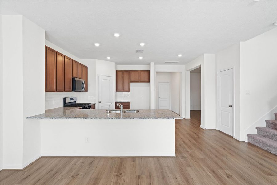 This spacious kitchen has it all—ample storage, generous counter space, and a layout that truly makes it the heart of the home. This spacious kitchen has it all—ample storage, generous counter space, and a layout that truly makes it the heart of the home.