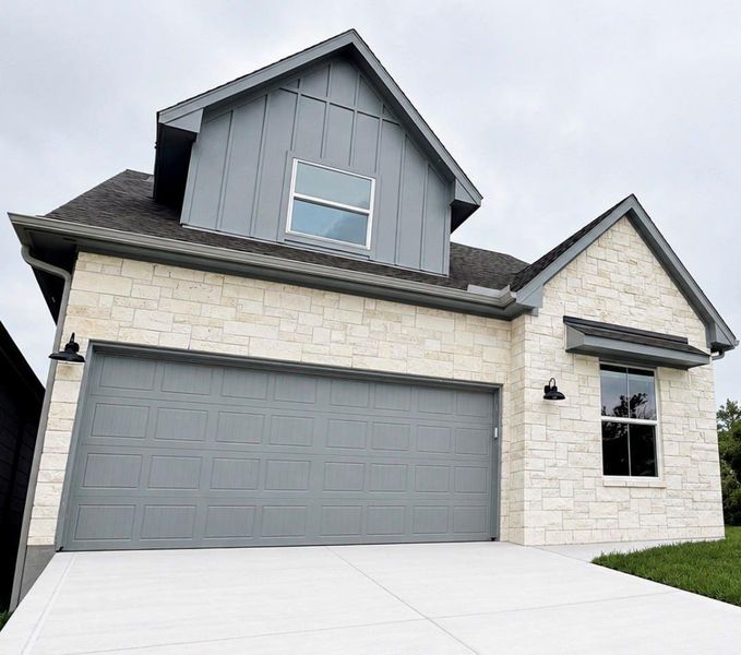 Front exterior of a new home in , Conroe, TX, highlighting curb appeal (Image 23).