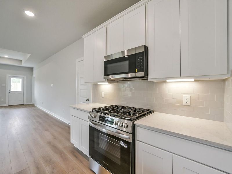 Furnished interior view inside a new home in Caney Creek Place, Conroe (Image 12).