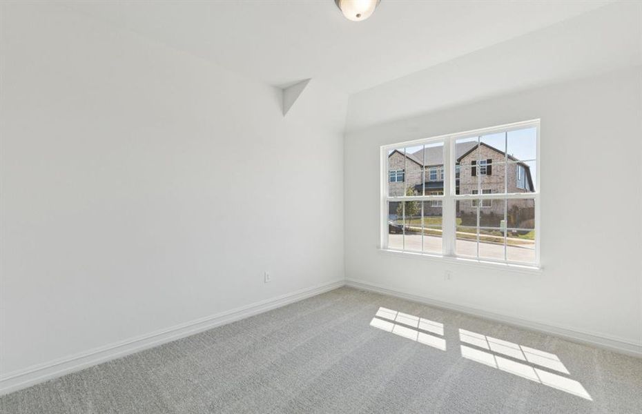 Spacious secondary bedroom with large windows Spacious secondary bedroom with large windows