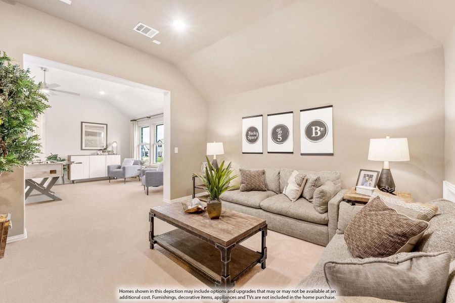 Living room with vaulted ceiling, gray sofa, wood coffee table, and open view to adjacent sitting room with carpet flooring Living room with vaulted ceiling, gray sofa, wood coffee table, and open view to adjacent sitting room with carpet flooring