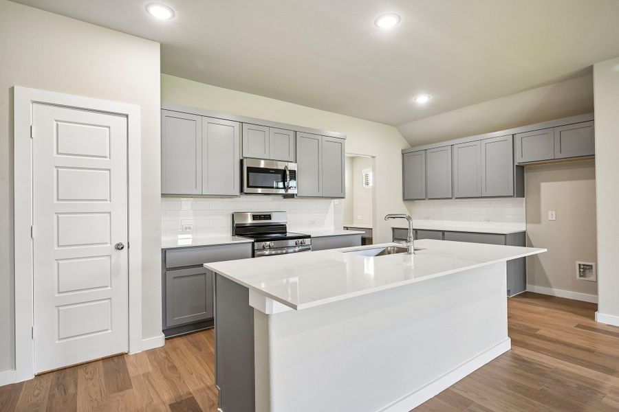 Kitchen in the Harrison home plan by Trophy Signature Homes