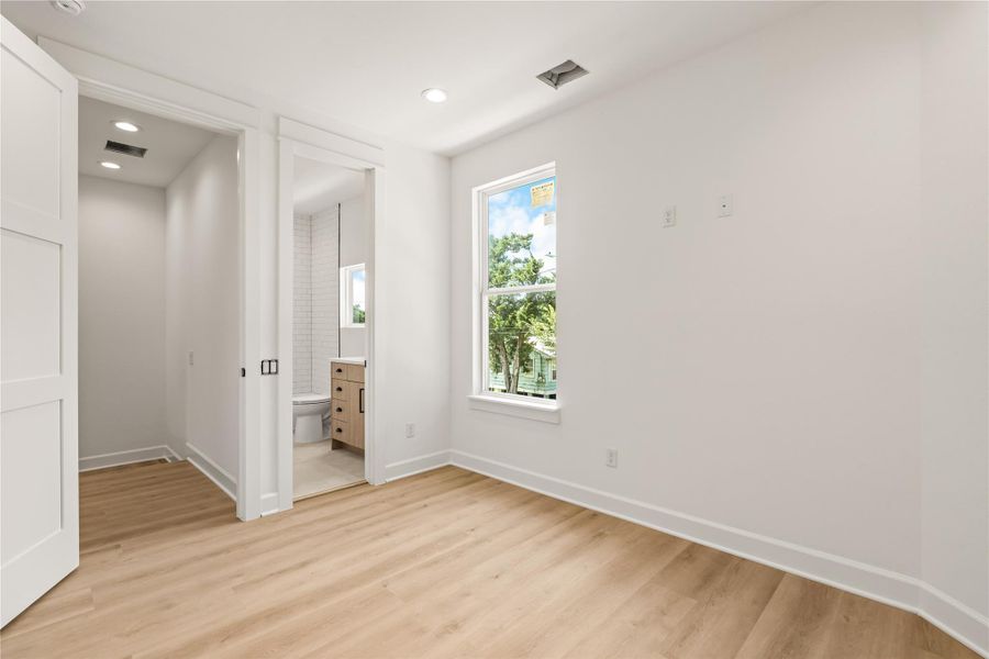 The secondary bedroom's en-suite entry — a full bath for every bedroom, by design The secondary bedroom's en-suite entry — a full bath for every bedroom, by design