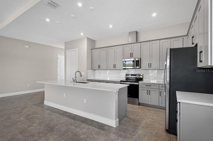 Furnished interior view inside a new home in Gray Hawk at Hole Two, Daytona Beach (Image 10).
