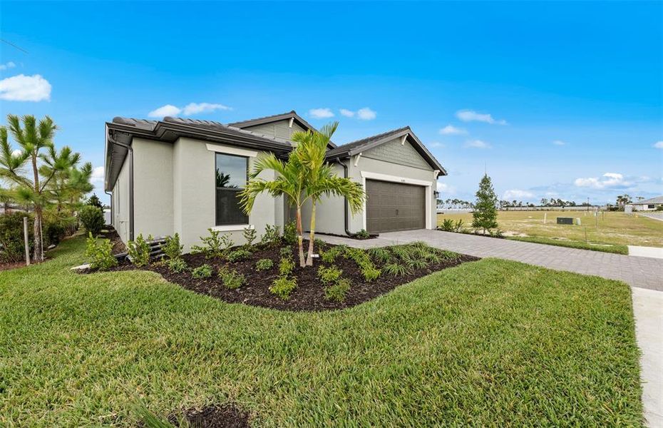 Front exterior of a new home in , North Port, FL, highlighting curb appeal (Image 18). Front exterior of a new home in , North Port, FL, highlighting curb appeal (Image 18).