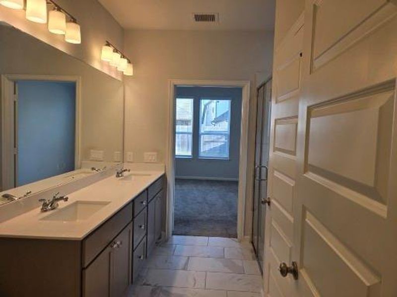 Primary bathroom view int primary bedroom