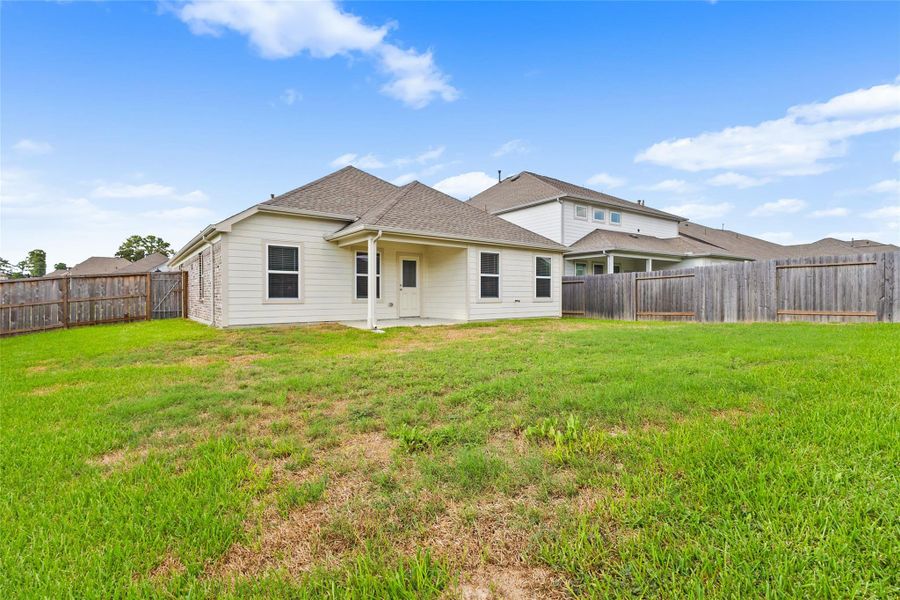 Your spacious fenced backyard offers plenty of open lawn for outdoor activities, pets, gardening, or future enhancements. Your spacious fenced backyard offers plenty of open lawn for outdoor activities, pets, gardening, or future enhancements.