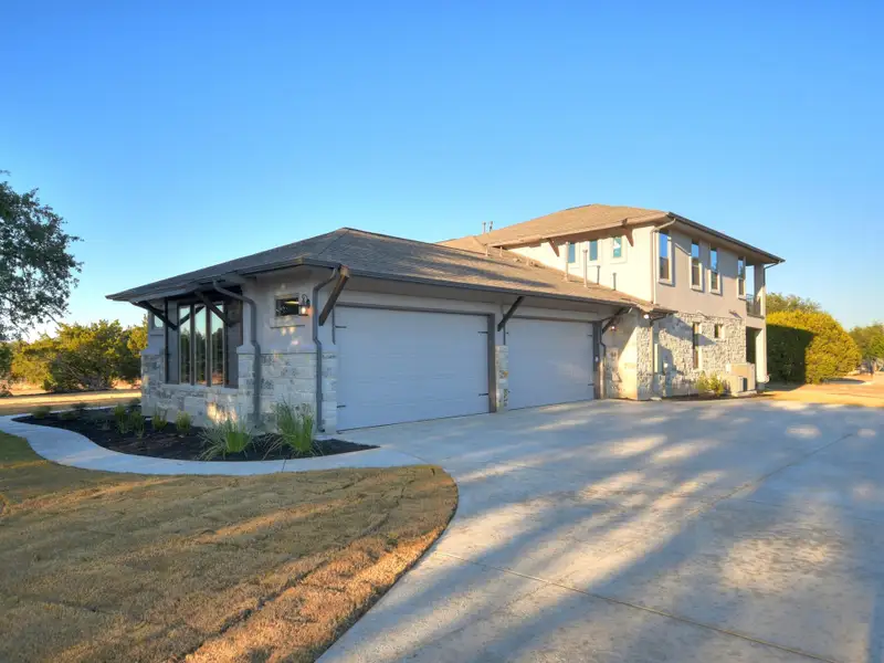 Representative exterior photo of a completed home built from the Santa Barbara II by Giddens Homes in Scofield Farms Estates, Georgetown, TX (Image 26).