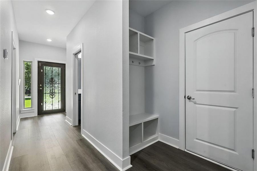 Mudroom featuring dark wood-style flooring and recessed lighting