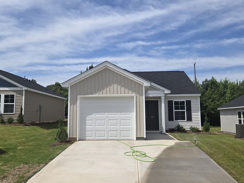 Front exterior of a new home in Evergreen, Spartanburg, SC, highlighting curb appeal (Image 1). Front exterior of a new home in Evergreen, Spartanburg, SC, highlighting curb appeal (Image 1).