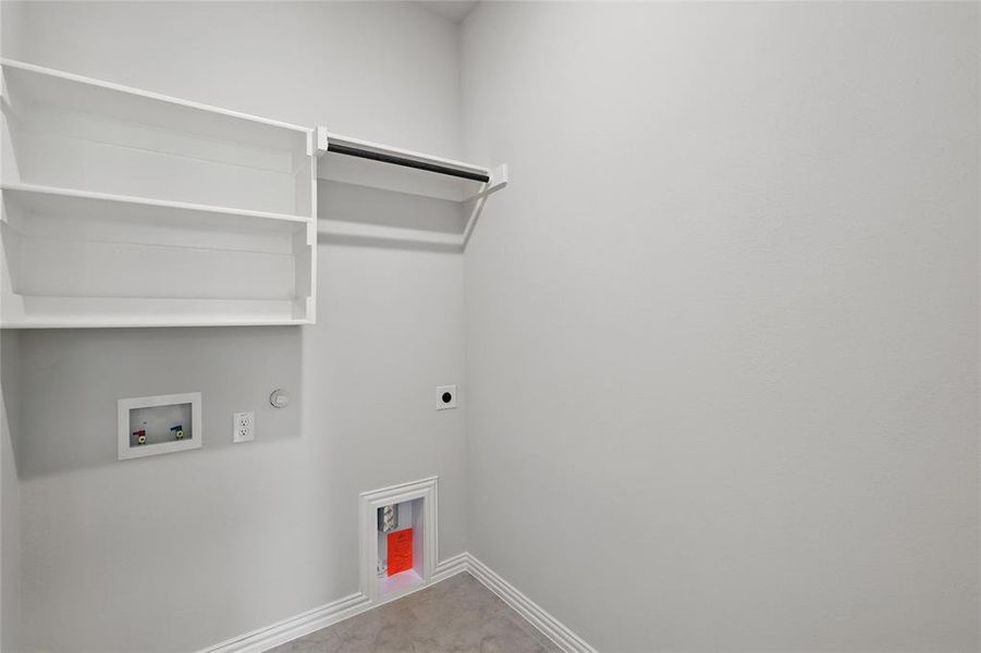 Laundry room featuring gas dryer hookup, electric dryer hookup, washer hookup, and baseboards