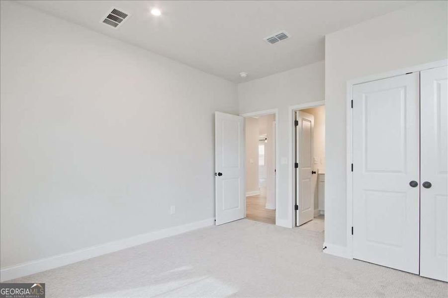 Spacious, unfurnished interior of a new home in The Paddocks at Doc Hughes, Buford (Image 39).