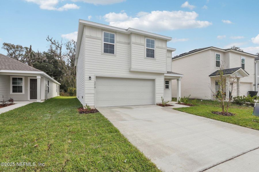 Front exterior of a new home in Kings Landing, Jacksonville, FL, highlighting curb appeal (Image 26). Front exterior of a new home in Kings Landing, Jacksonville, FL, highlighting curb appeal (Image 26).